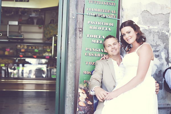 newlywed sitting outside resteraunt - wedding photo by top Rome based destination wedding photographer Rochelle Cheever, Rome Weddings Photography